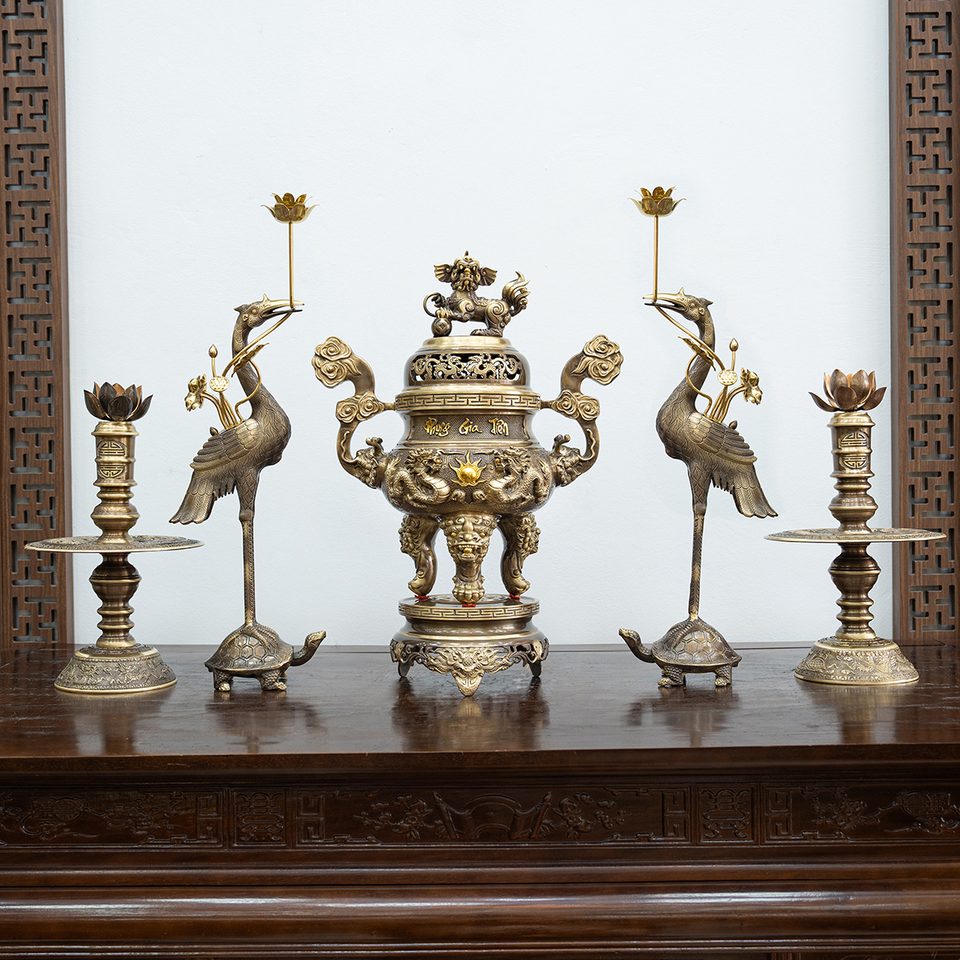 Five-piece bronze altar set in antique patina on a hardwood altar table