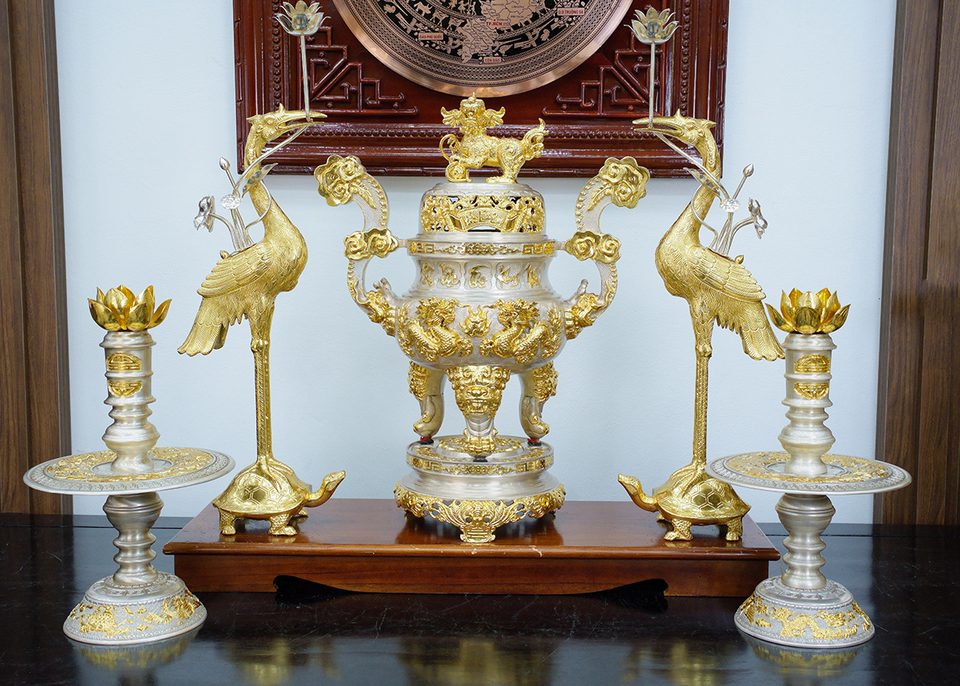 Dark patinated bronze altar set with silvered candlesticks